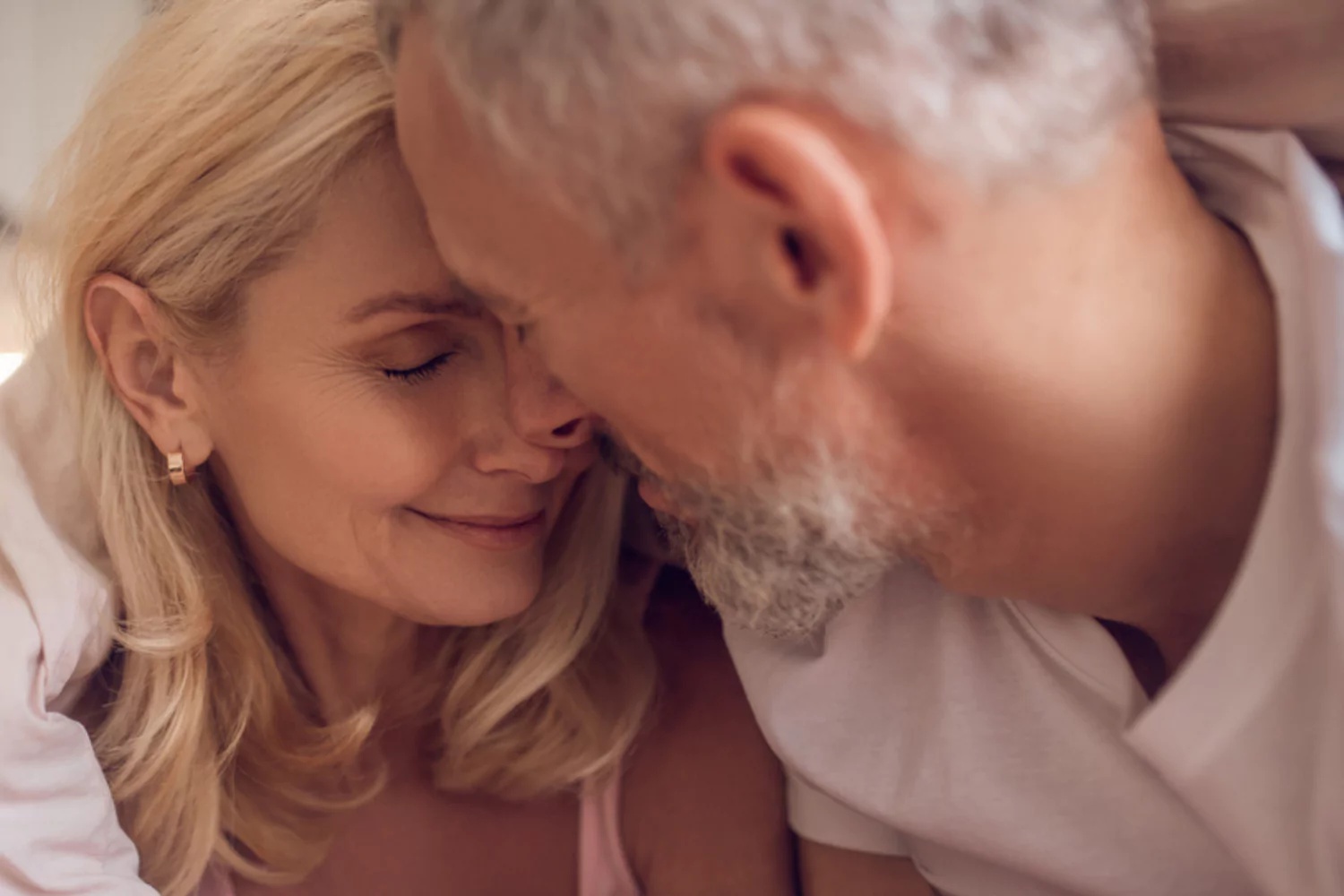 Mature couple sharing a calm, affectionate moment at home